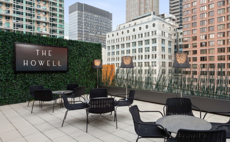 spacious rooftop with outdoor media center and seating options